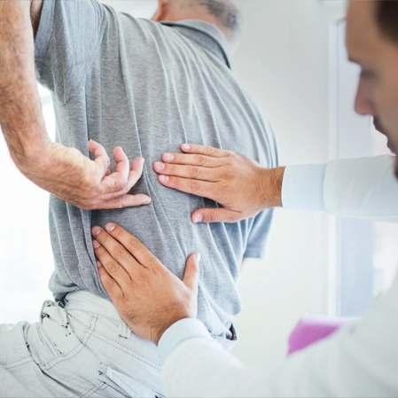 Chiropractic Colorado Springs CO Man With Back Pain